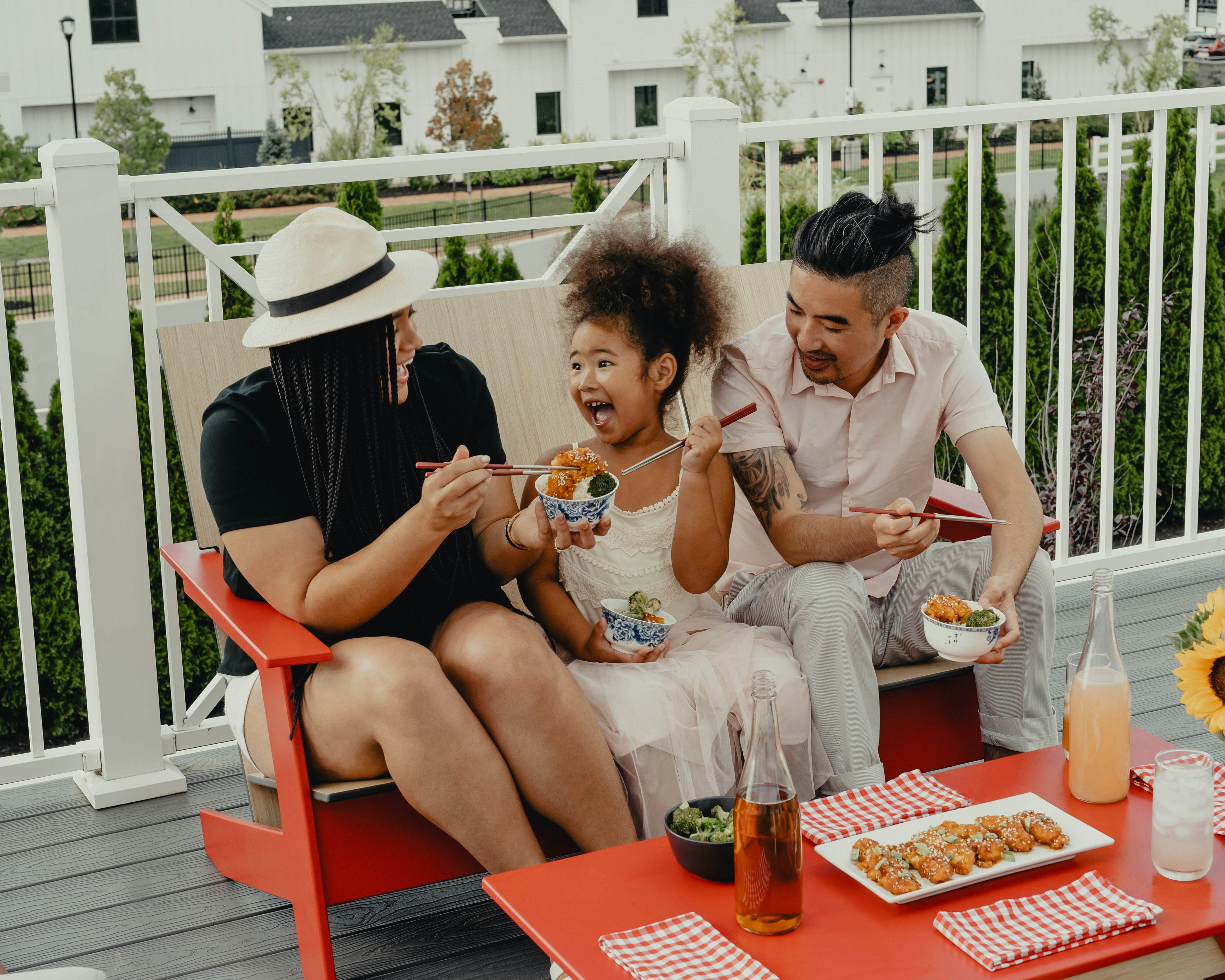A family enjoying time together on their porch.