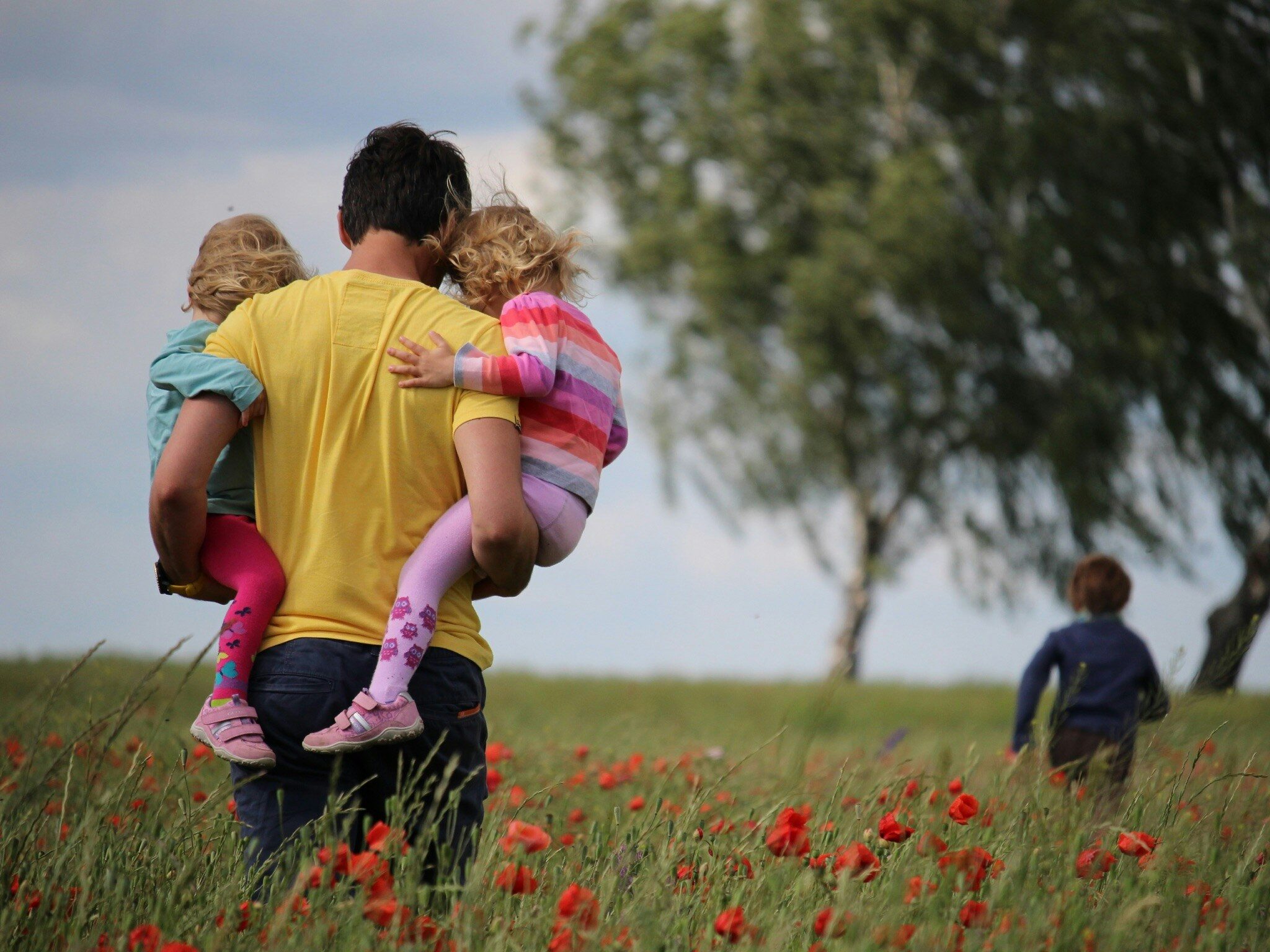 Father spending time with his children outdoors.